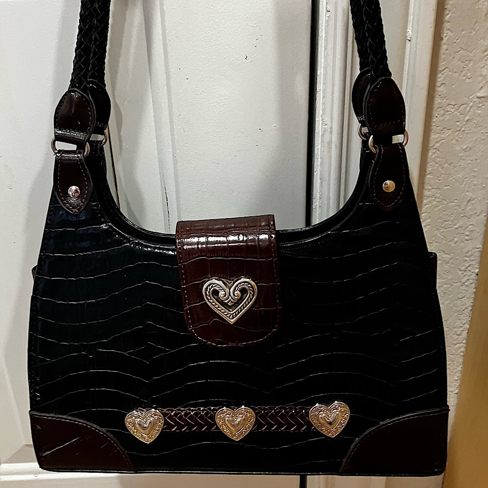 Like new, crocodile material, medium size.